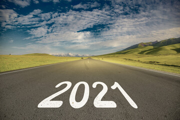 asphalt road with 2021 with blue abstract sky