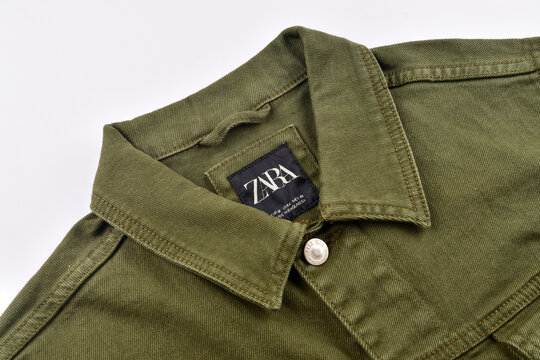 Zara denim jacket on white background, closeup on tag of zara