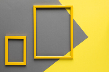 Illuminating Yellow photo frame on Ultimate Gray  background.Trendy Color year
