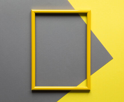 Illuminating Yellow Photo Frame On Ultimate Gray  Background.Trendy Color Year