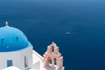 Fototapeta premium Architecture and landscape of the Santorini island., famous luxury travel vacation getaway. Oia white village with Blue Domes and mills. Amazing warm sunny day