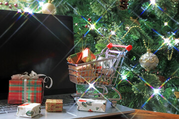christmas tree and gifts. Online Christmas shopping concept.