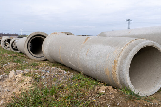 Concrete Sewage Pipes On The Ground Prepare For Underground Instalation