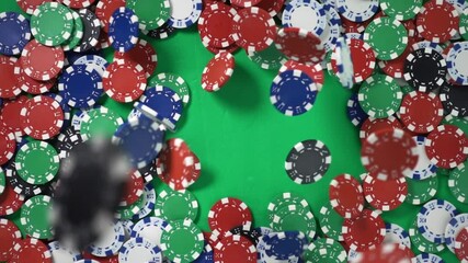Casino chips falls from above on border green table in slow motion theme win jackpot. Concept of playing hazard poker game. Theme of winning and losing money. Gambling as entertainment at leisure time - Powered by Adobe
