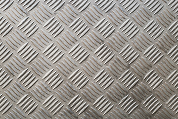 Industrial metal checker plate. Metal checker plate texture background. Metal checkerplate for anti skid. Embossed metal sheet.