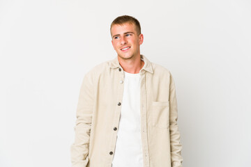 Fototapeta premium Young caucasian handsome man laughs and closes eyes, feels relaxed and happy.