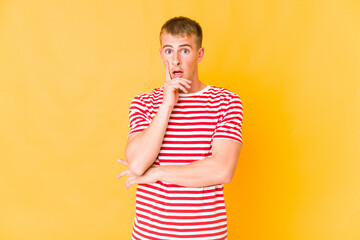 Young caucasian handsome man having some great idea, concept of creativity.