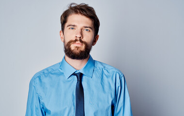 Business man in a blue shirt with a coin in his hand cryptocurrency Bitcoin finance model