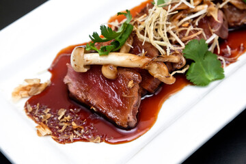 japanese food spicy teriyaki beef steak dish, beef in spicy sauce with mushrooms 