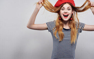 cheerful woman in red hat tousled hair model emotions