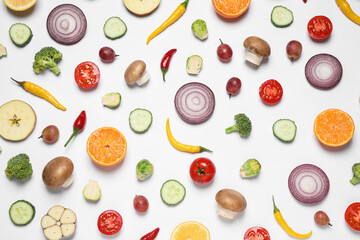 Fresh organic fruits and vegetables on white background, flat lay