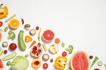 Fresh organic fruits and vegetables on white background, flat lay. Space for text