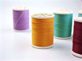 sewing thread and needle ,Sewing spool of thread and scissors isolated on white background	