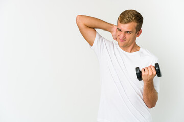 Young caucasian man holding a weight isolated on white background