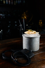 cocktail alcohol in a mug with ice, ginger and lime