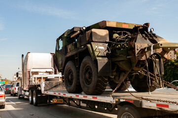 Military transport vehicle being transported