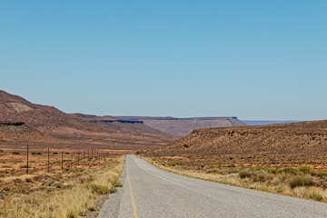 Straight road through flat topped hills in Karoo