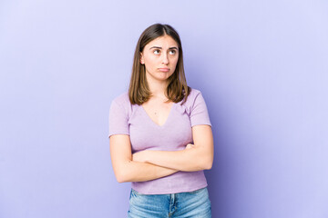 Young caucasian woman tired of a repetitive task.