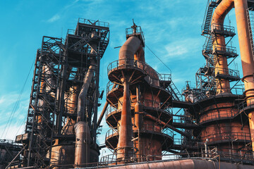 Blast furnace of metallurgical plant or chemical factory, large steel industrial buildings and...
