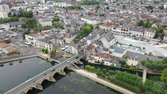 View from drone of houses and Cher river at Vierzon town at summer day, France