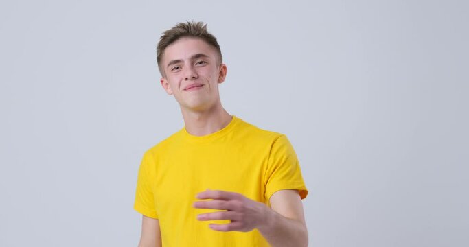 Man in yellow t-shirt inviting to come