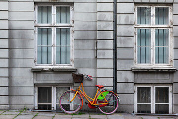 Bicycle in Front of a Grey House