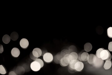 Fototapeta Lights blurred bokeh abstract on dark background, rozmyte światełka na ciemnym tle lampki świąteczne obraz