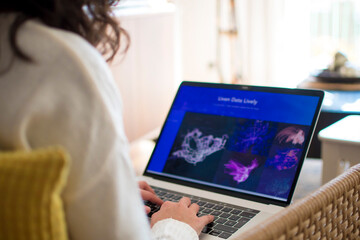 Young woman working from home with laptop