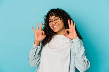 Young african american afro woman isolated cheerful and confident showing ok gesture.