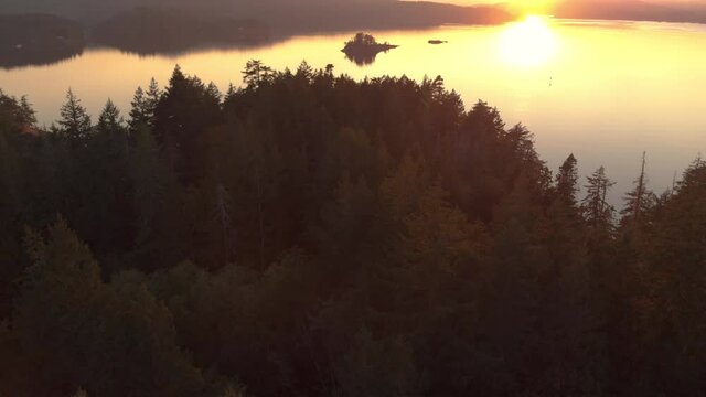 Aerial sunrise drone footage of the rugged coastline of the east side of Vancouver Island. 4K 24FPS