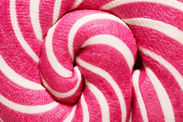 Swirly red and white Lollipop candy abstract background. Close-up.