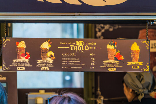 Czech national street food trdlo is being sold in street vendor's shop at the Old Town square square of Prague during Christmas time:Prague,Czech Republic-December 15,2017