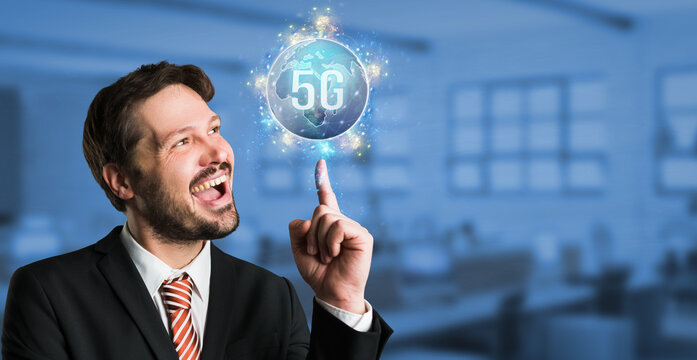 businessman with a virtual world map with message 5G over his head in front of an office background