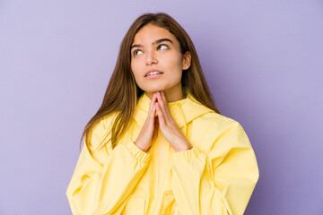 Young skinny caucasian girl teenager on purple background making up plan in mind, setting up an idea.