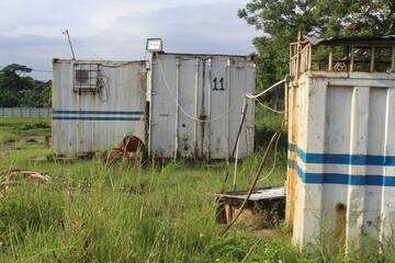 Fototapeta na wymiar white colored storage containers in the bush