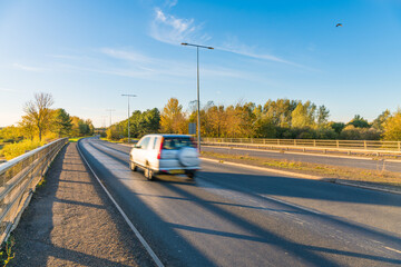 Dual carriage way with car in motion  