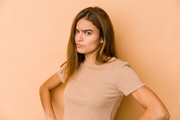 Obraz premium Young skinny caucasian teenager girl frowning face in displeasure, keeps arms folded.
