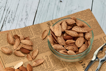 Almond kernels-roasted salted almonds lie on a light background.