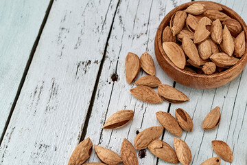 Almond kernels-roasted salted almonds lie on a light background.
