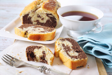 Homemade marble cake and cup of tea