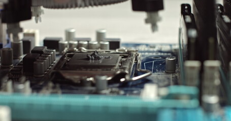 Removing And replacing CPU cooler on modern PC computer motherboard. Installing and removing radiator CPU on the motherboard. CPU cooling system on pc. View of the disassembled computer.