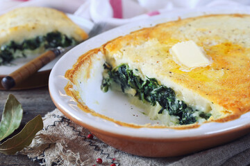 Moussaka. Potato casserole (gratin) with spinach. Greek cuisine