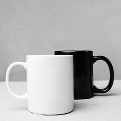 Mug mockup. Two ceramic mugs on grey background. Blank coffee or tea mugs. Black cup and white cup.
