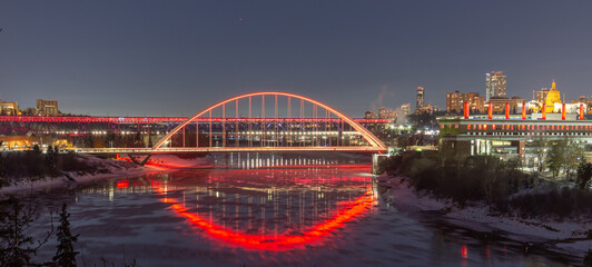 Fototapeta na wymiar Bridge Lit up at Night Remembrance Day, City in Background