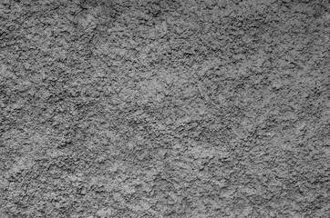 gray background, plaster on the wall of the house