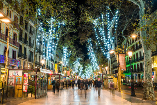 Night view of La Rambla street during Christmas season. La Rambla is a street in central Barcelona. A tree-lined pedestrian street, it stretches for 1.2 kilometres: BARCELONA, SPAIN - DECEMBER 2018