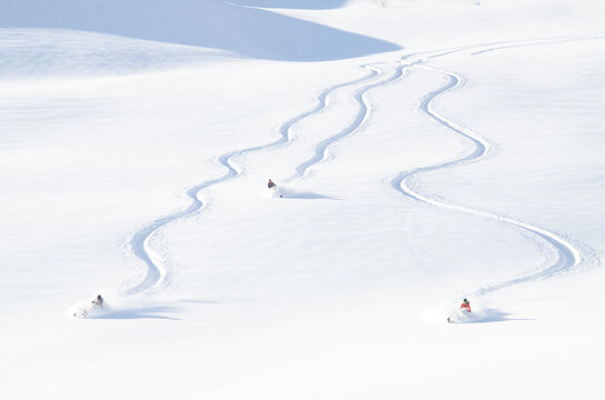Snowmachine and rider in Alaskan backcountry.