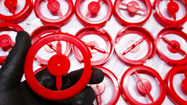 Red round cosmetic plastic ,  From the manufacturing department in a plastic factory.