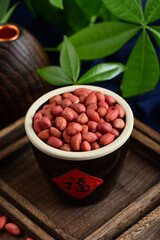 Peanuts on the background of retro Chinese style.The Chinese meaning in the picture is happiness