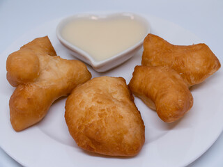 Chinese bread sticks with sweetened condensed milk can be breakfast or dessert